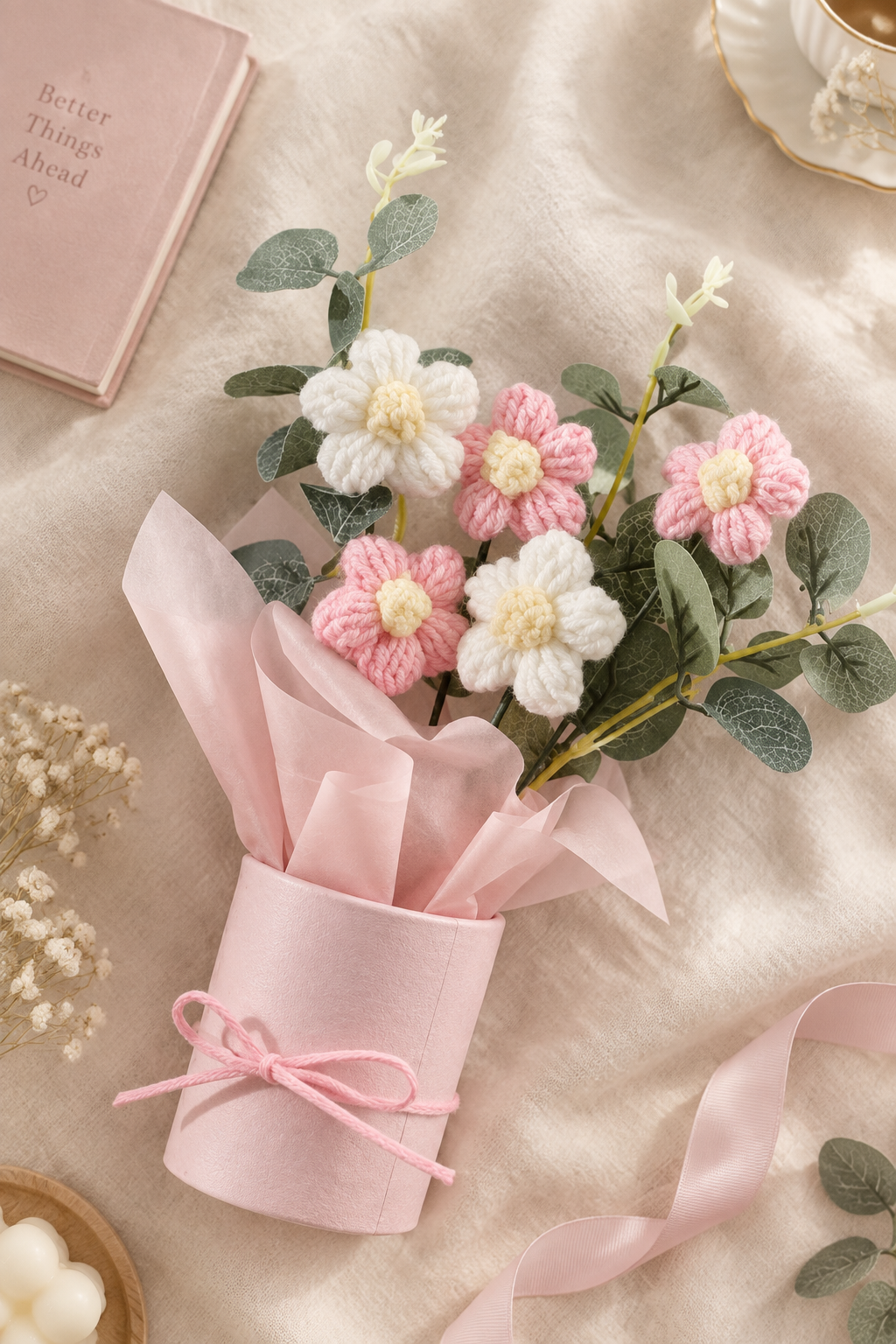Pink crochet flower bouquet lifestyle shot on cream linen