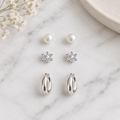 Silver 3-pair earring set on white marble